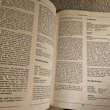 Open book with text on a textured surface