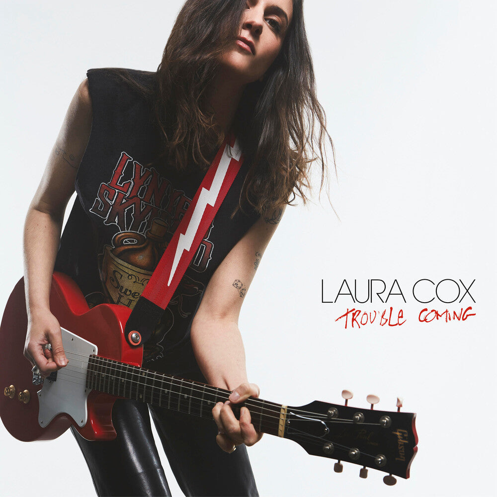 the album cover for Laura Cox - Trouble Coming (Blk) [Colored Vinyl] (Gate) (Wht)